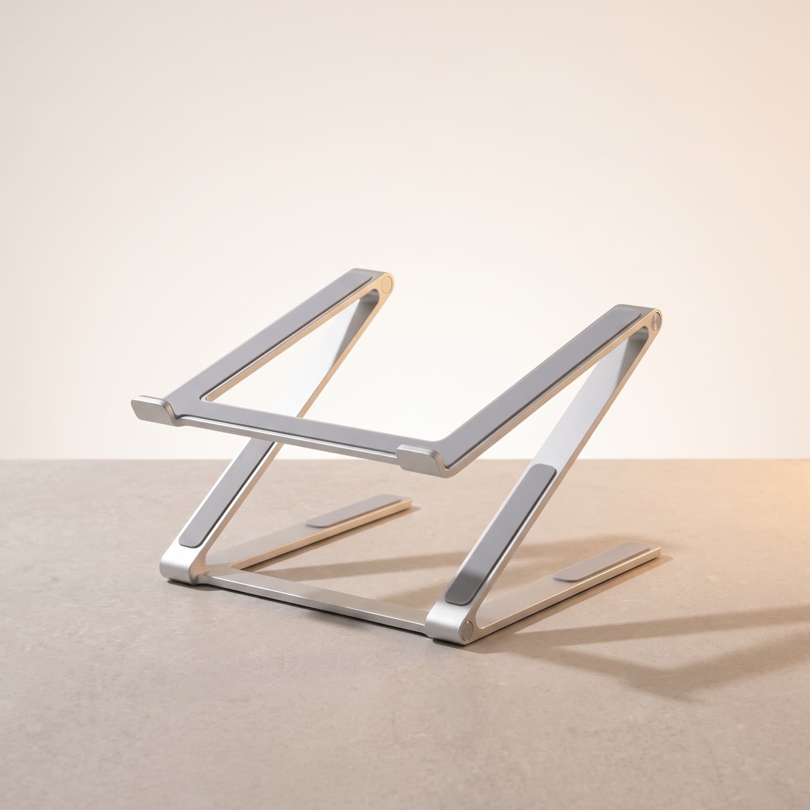 Elevate Laptop Stand — Adjustable aluminium laptop stand for better posture.